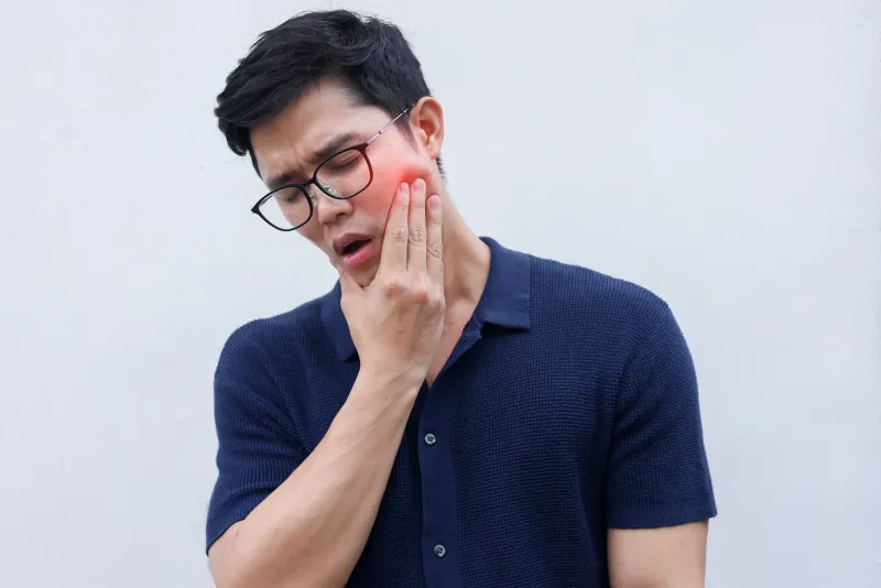 Patient receiving oral biopsy consultation